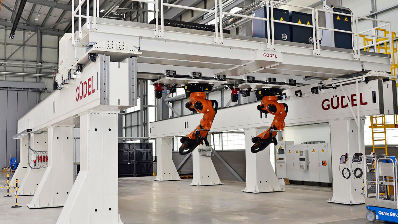 Editor's Note: Brenda Courim, Head of Sales at Güdel, provided the first two predictions. Mike Peek, Marketing Manager at Güdel, provided the third prediction.
What robotic technology/technologies do you expect will make the most impact in 2026? 
In 2026, the most impactful industrial robotics technologies will be those that expand robot reach, stiffness, and flexibility without adding complexity. Large-workspace linear motion systems, gantries, and modular RTUs will increasingly be used to turn standard robots into multi-process, scalable platforms. Combined with improved calibration and software-driven control, these systems will allow manufacturers to automate larger, heavier, and more variable processes while preserving precision and uptime.
What is your boldest robotics prediction for 2026? 
By 2026, flexibility will matter more than peak speed in industrial robotics, and linear motion will move from a secondary component to the structural backbone of many automation systems. Manufacturers will increasingly design robotic cells around gantries, tracks, and RTUs first - using them to cover larger work envelopes, consolidate processes, and enable reconfiguration - rather than optimizing for maximum cycle time in fixed cells. Systems that can be extended, repurposed, and adapted over time will outperform faster but rigid installations in long-term value and adoption.
What industry/industries do you expect will invest more in robotics and automation in 2026 and why? 
The strongest investment in 2026 will come from high-mix, capital-intensive industries facing labor shortages and product variability. Automotive, Defense, and their Tier suppliers, heavy manufacturing, and industrial logistics will lead adoption as they move toward flexible, system-level automation strategies focused on uptime, adaptability, and long-term efficiency rather than single-purpose robotic cells.