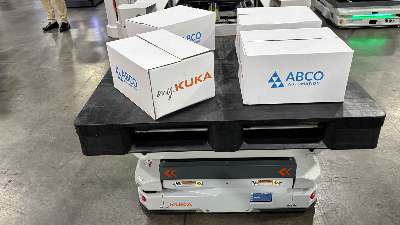 KUKA's booth featured the company's industrial robot arms in addition to its AMR lineup.