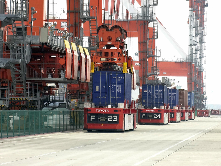 Autonomous vehicles for container transport in a seaport.