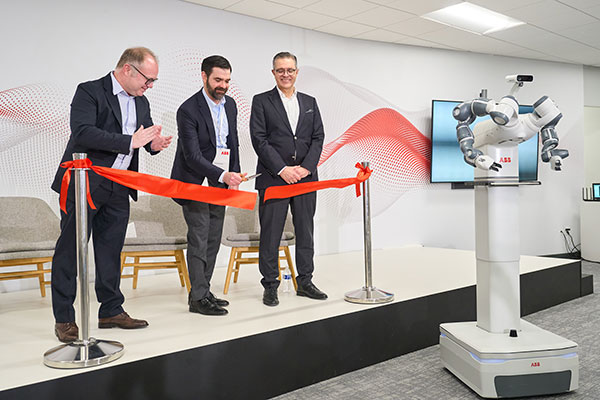 ABB's Marc Segura, John Bubnikovich and Sami Atiya cut the Ribbon on ABB Robotics renovated facility in Auburn Hills, Mich.