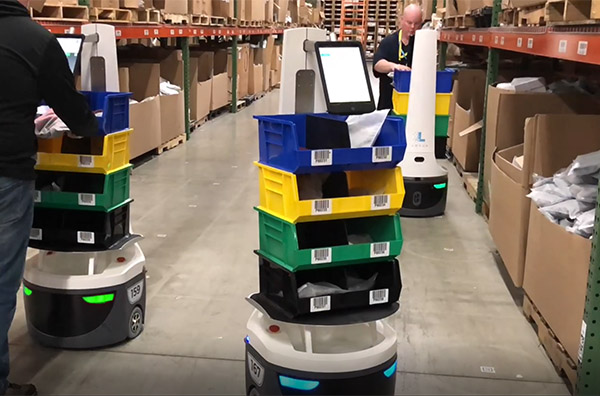 Locus robots and software work with human pickers to fulfill orders.