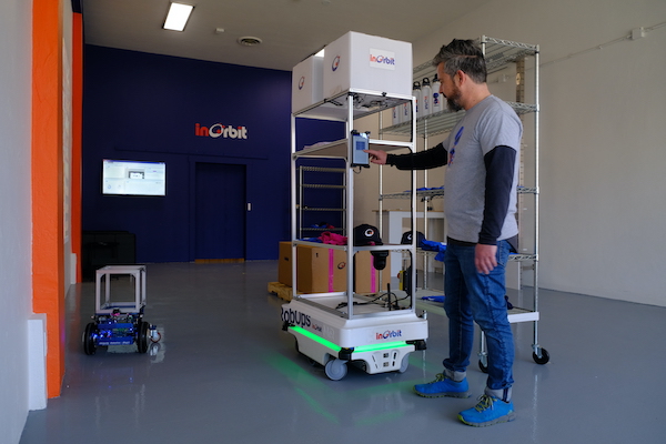 InOrbit CEO Florian Pestoni demonstrates robots at work in the new Robot Space.
