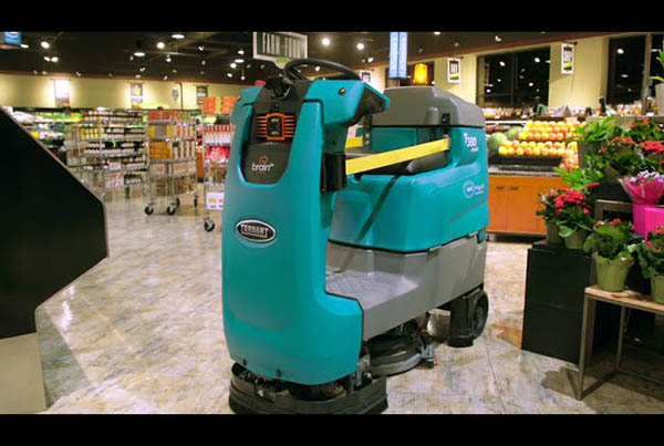 The Tennant T380AMR ride-on robotic scrubber uses BrainOS for autonomy.