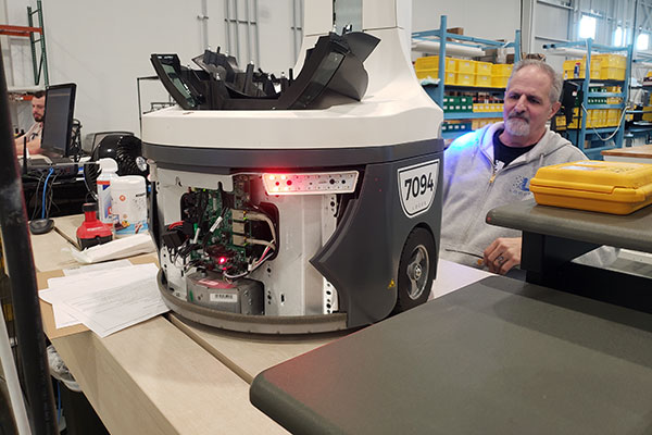 A dedicated team of employees manufacture, refurbish, and test person-to-goods robots at Locus’ new facility.