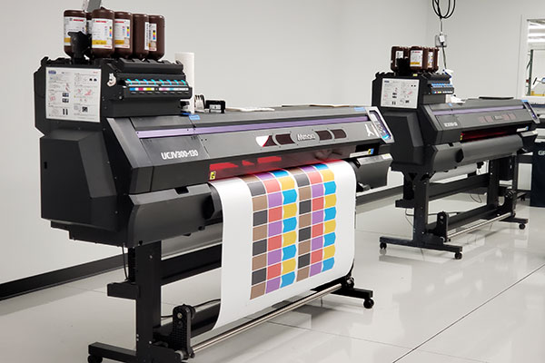At its on-site print lab, Locus prepares branded wraps for robots being set to customers, who send in design options to personalize robots for their facilities.