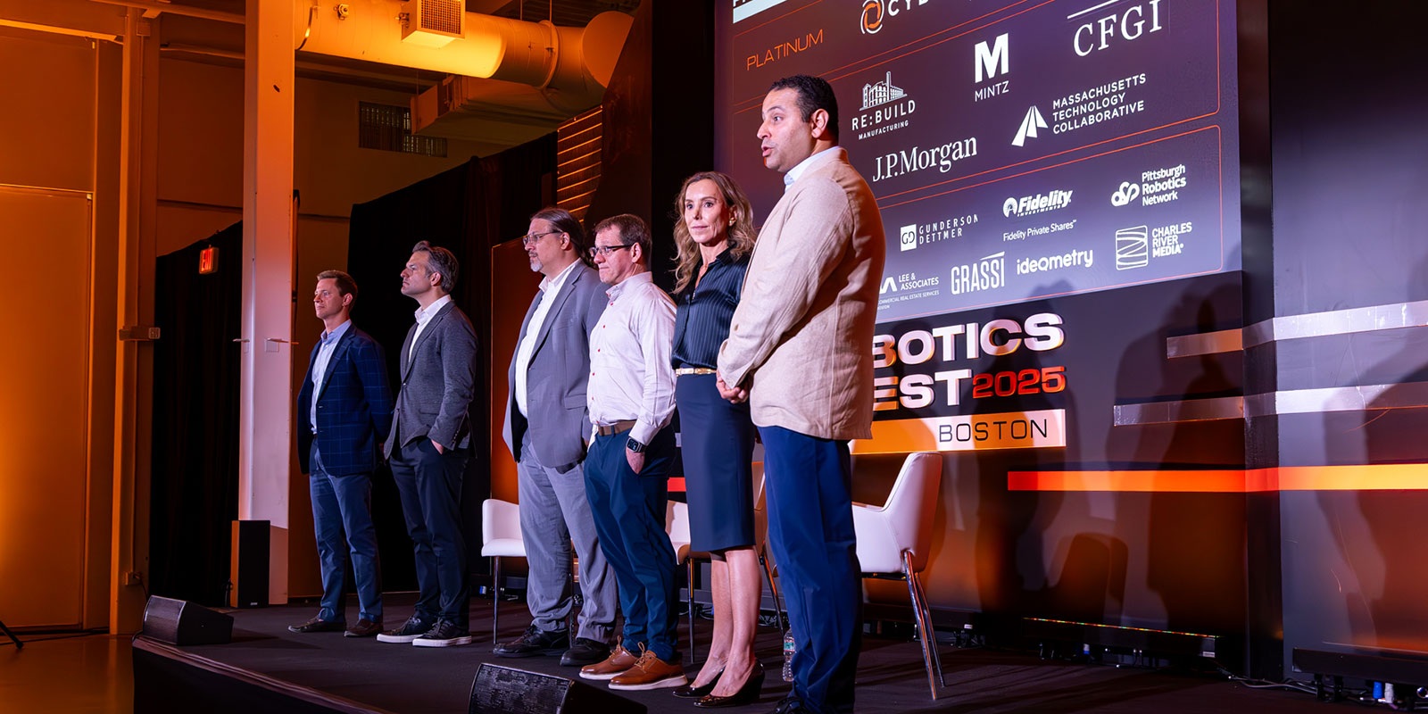 Saad walcomed the Robotics Invest 2025 underwriters to the stage. “We insist on calling them underwriters, not sponsors, because from day one we want to emphasize this idea that they are partners.” 
Representatives included Justin Femmer, CFGI CCO; Justin Krauss, J.P. Morgan managing director of commercial banking, head of applied tech & innovation economy; Peter Haas, MassTech director of robotics; Marc D. Mantell, Mintz partner and co-chair of mergers & acquisitions practice; and Carey Browning, Re:Build Manufacturing CCO. 
Photo by Donald Halsing | Peerless Media