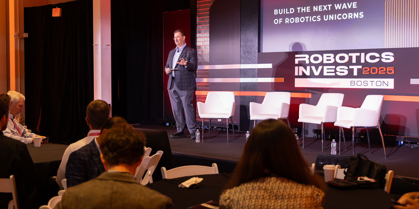 Martin shared opening remarks to kick off day two of the event, noting the seats in the conference hall had been re-arranged for roundtable discussions following two more presentations. 

Photo by Donald Halsing | Peerless Media