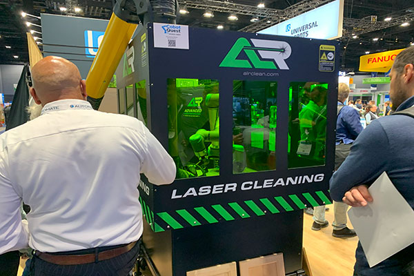 ACI Manufacturing, on display at the Teradyne Robotics booth demonstrated utilizing a laser attachment on a robot arm for cleaning purposes.