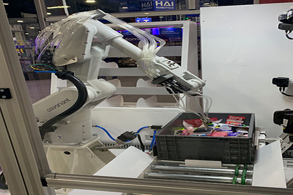 Covariant announced its RFM-1 at the show. Here is a robotic arm utilizing the Covariant Brain system in action.