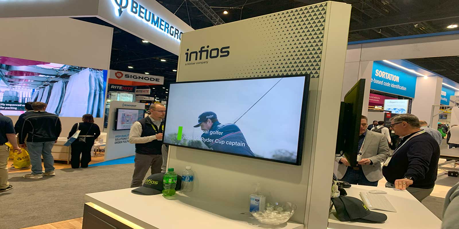 Newly rebranded Infios (formerly Korber Supply Chain Software) showcased its new color scheme and warehouse automation integration technologies,