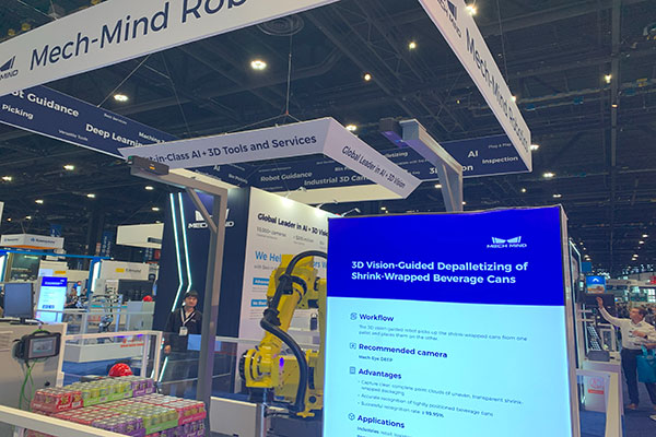At the Mech-Mind Robotics booth, users saw multiple offerings on display, including this 3D-vision guided robot arm performing depalletizing of shrink-wrapped beverage cans. 